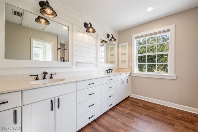 bathroom with vanity and hardwood / wood-style floors