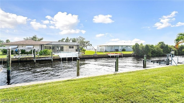 dock area featuring a water view, a yard, and a lanai