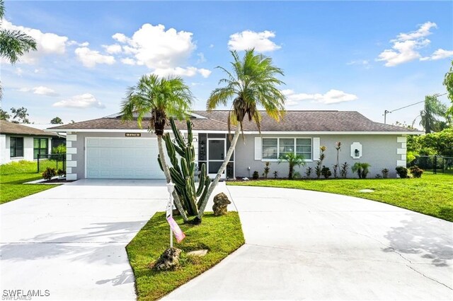 ranch-style house with a garage and a front yard