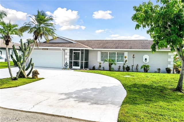 ranch-style house with a garage and a front lawn