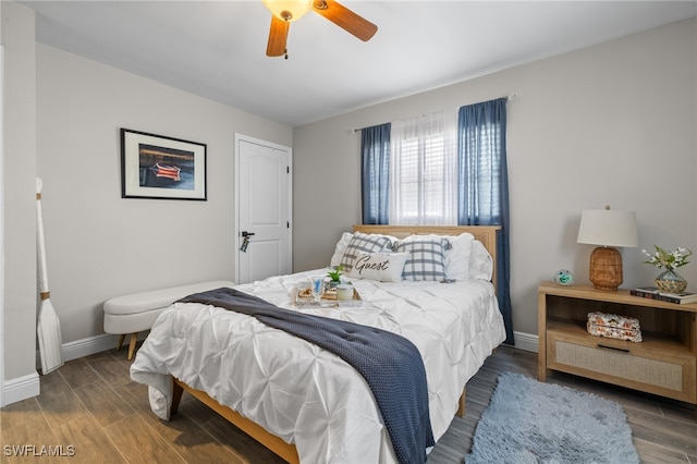 bedroom with ceiling fan and wood-type flooring