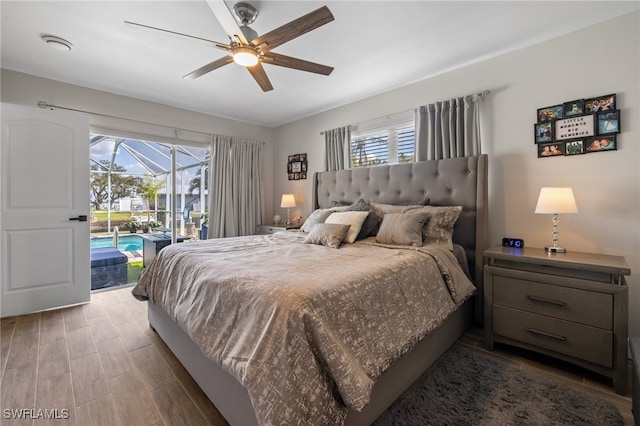 bedroom with ceiling fan, hardwood / wood-style floors, and access to outside