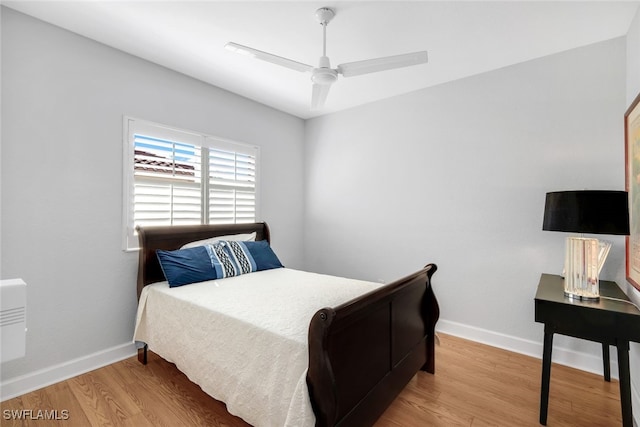 bedroom with hardwood / wood-style flooring and ceiling fan