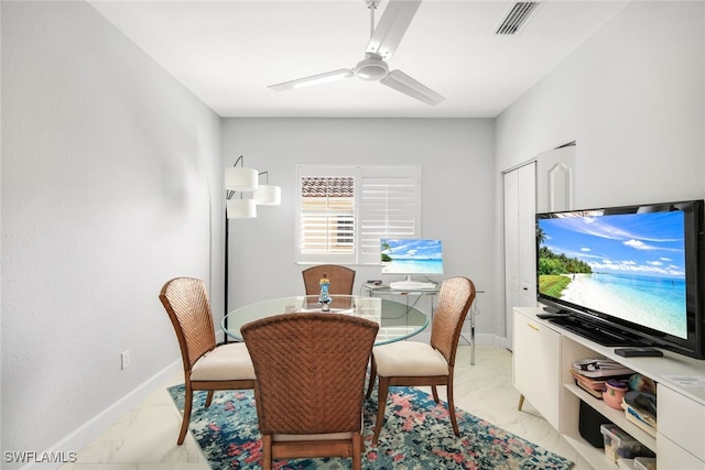 dining space with ceiling fan