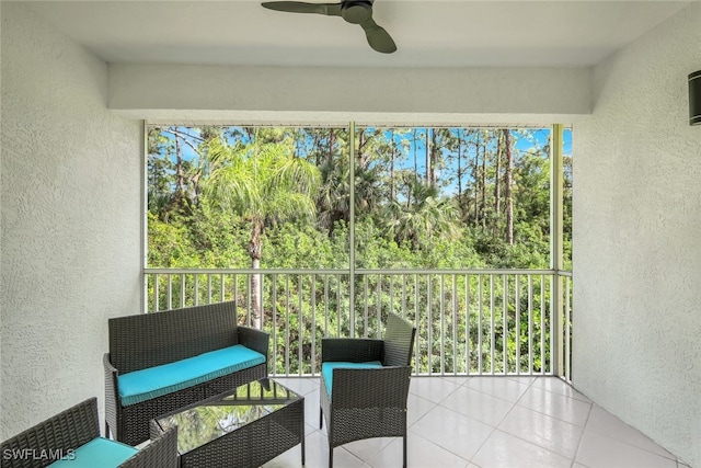 sunroom with a wealth of natural light and ceiling fan