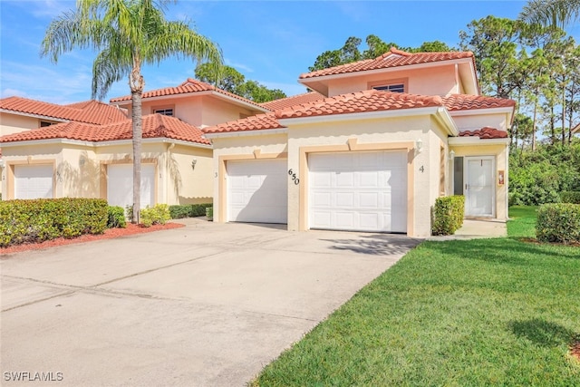 mediterranean / spanish-style house with a front yard