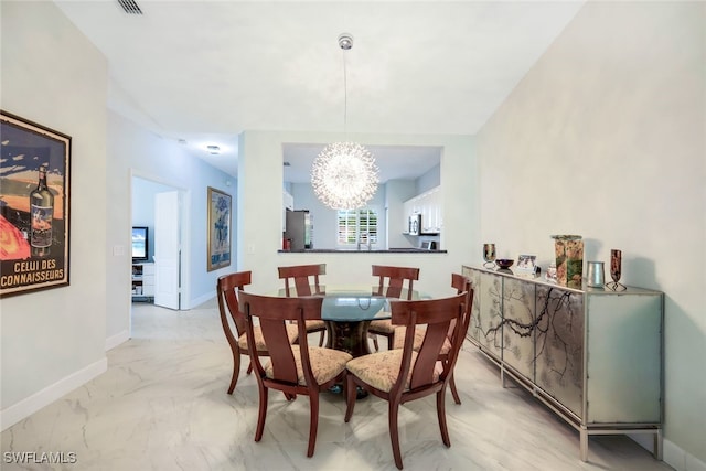 dining room featuring a chandelier