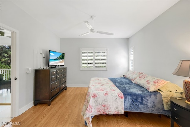 bedroom with light hardwood / wood-style floors and ceiling fan