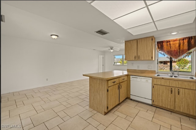 kitchen with sink, kitchen peninsula, dishwasher, and ceiling fan