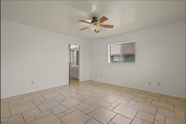 unfurnished room featuring ceiling fan