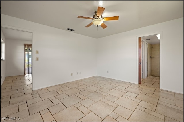 empty room featuring ceiling fan