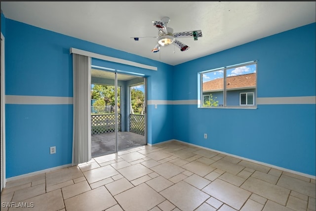 empty room with plenty of natural light and ceiling fan