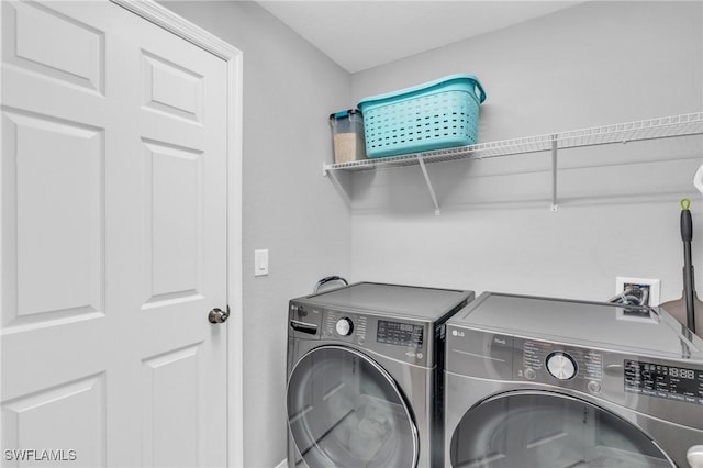 laundry area with washer and dryer