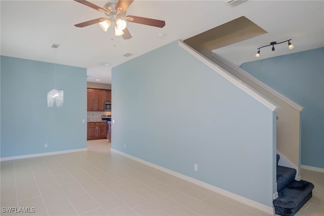 unfurnished living room with ceiling fan and rail lighting