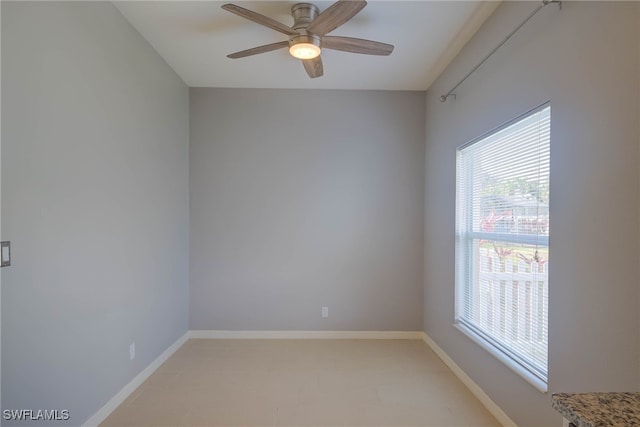 spare room with ceiling fan