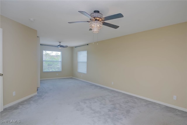 unfurnished room with light carpet and ceiling fan