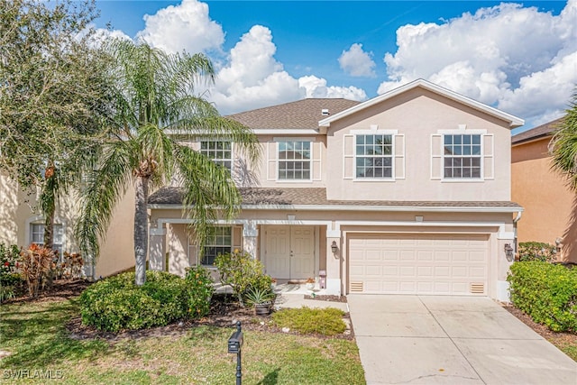 front of property with a garage