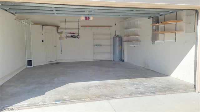 garage with a garage door opener, electric panel, and electric water heater