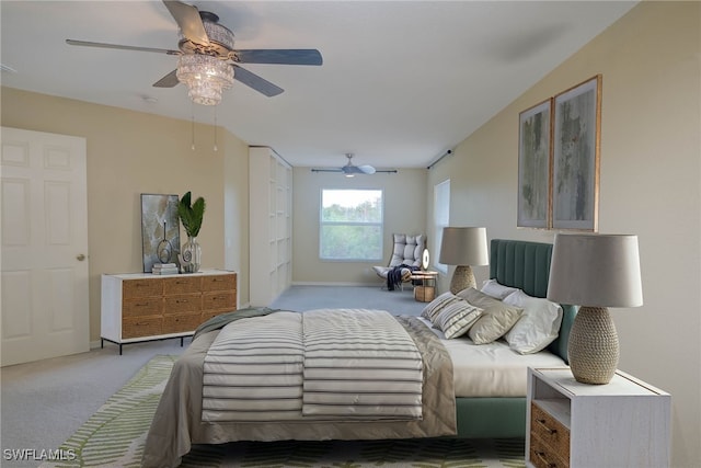 bedroom with light carpet and ceiling fan