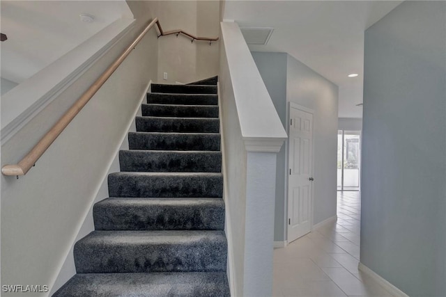 stairway featuring tile patterned floors