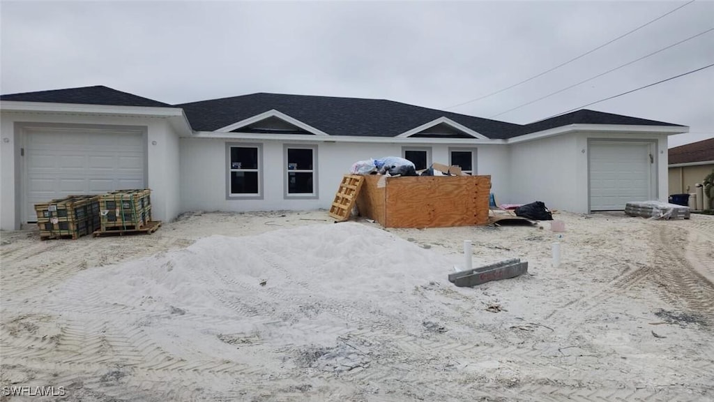 single story home featuring a garage