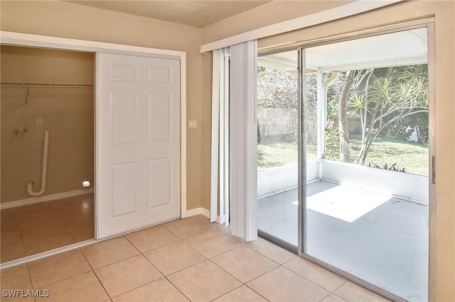 entryway featuring light tile patterned flooring