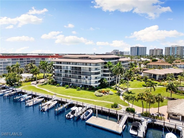 birds eye view of property with a water view