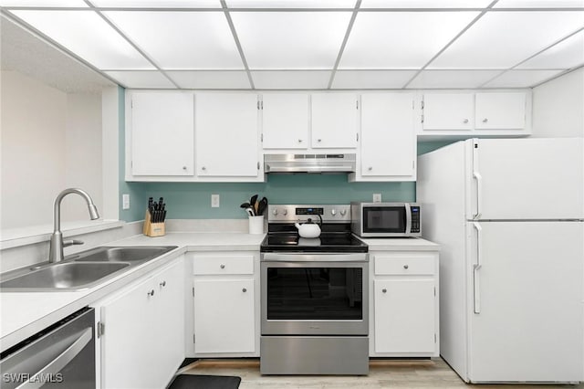 kitchen featuring sink, light hardwood / wood-style floors, white cabinets, and appliances with stainless steel finishes