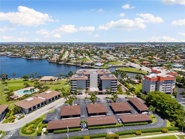 birds eye view of property with a water view