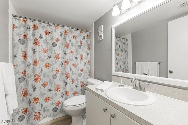 bathroom featuring vanity, toilet, and wood-type flooring