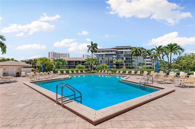 view of swimming pool with a patio area