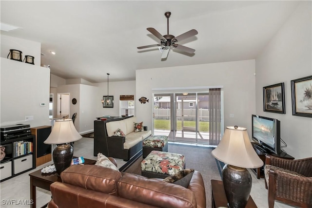 living room with vaulted ceiling, ceiling fan, and french doors