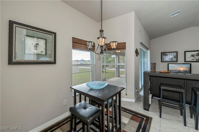 dining area with a notable chandelier, light tile patterned floors, lofted ceiling, visible vents, and baseboards