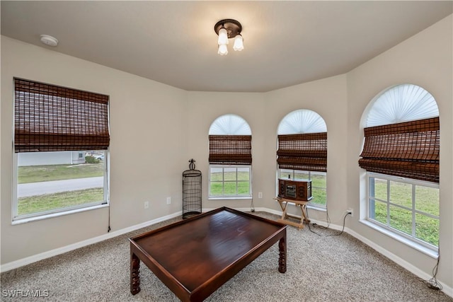 carpeted office featuring baseboards