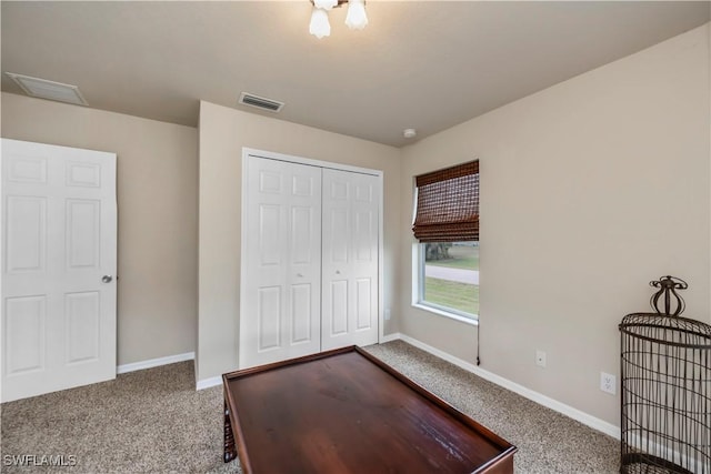 unfurnished bedroom with carpet floors and a closet