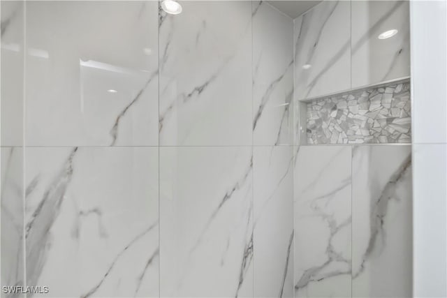 room details with a marble finish shower