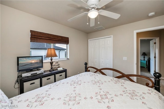 bedroom featuring ceiling fan and a closet