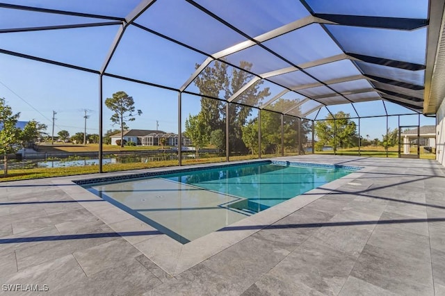 view of pool featuring a water view, a lanai, and a patio