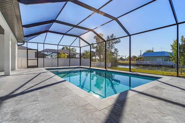 view of pool with a water view, a patio, and a lanai