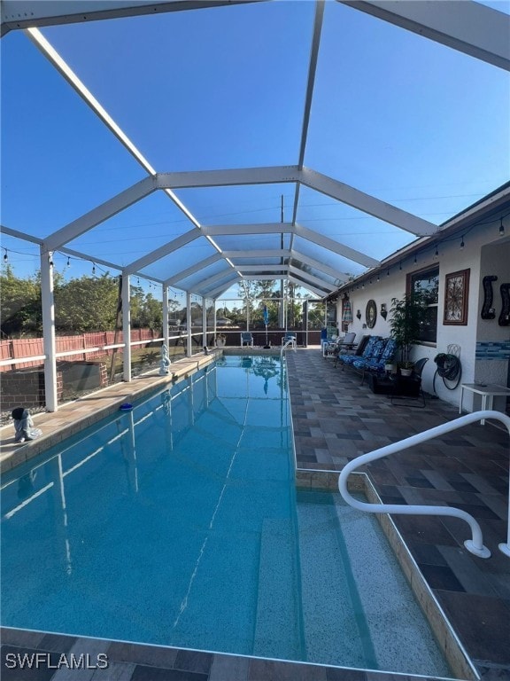 view of pool featuring a lanai and a patio area