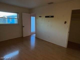 unfurnished room featuring light hardwood / wood-style flooring