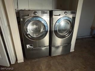 laundry room with washing machine and clothes dryer