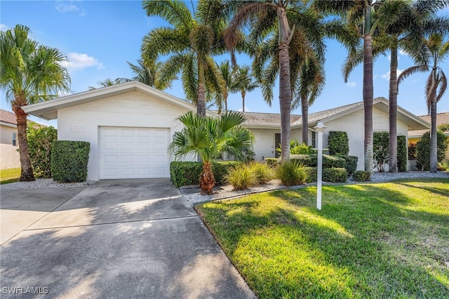 single story home featuring a garage and a front yard