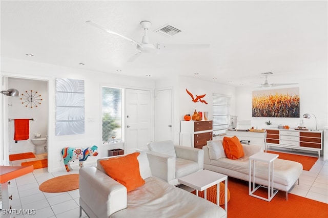 living room with ceiling fan and light tile patterned floors