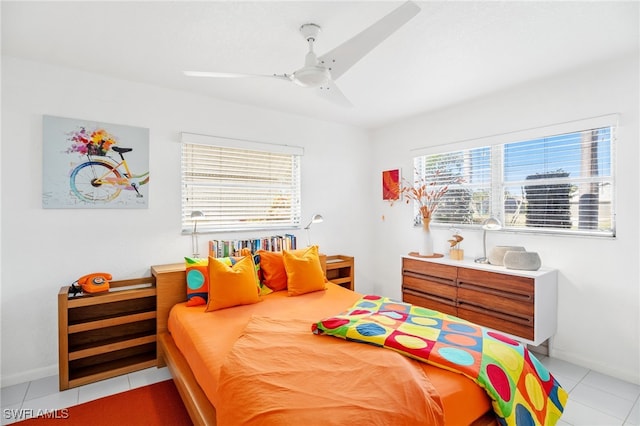 tiled bedroom with ceiling fan