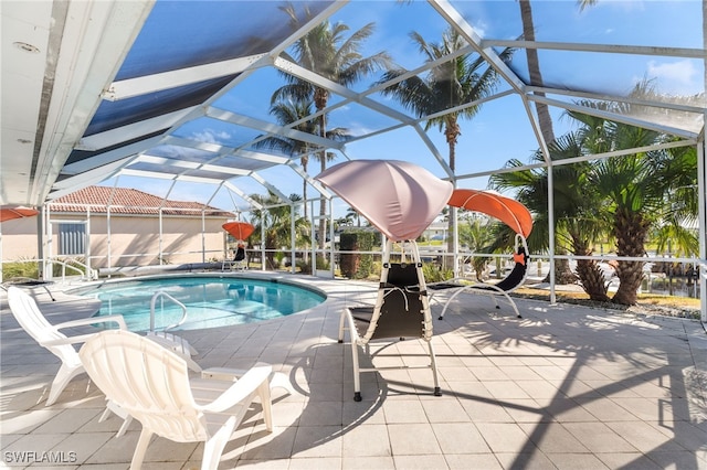 view of pool featuring a patio and a lanai