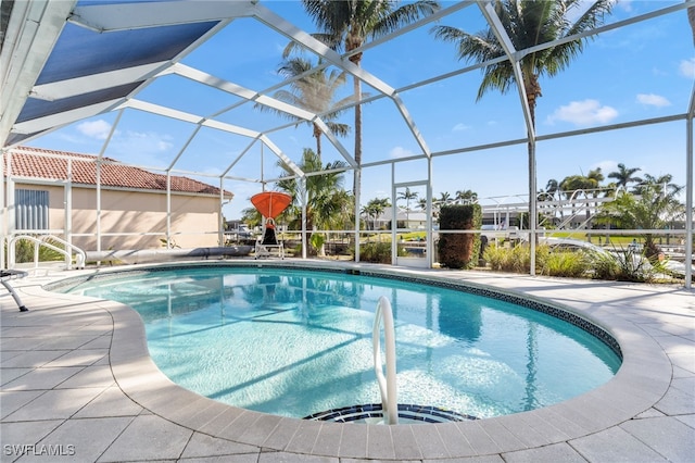 view of pool featuring a lanai and a patio area