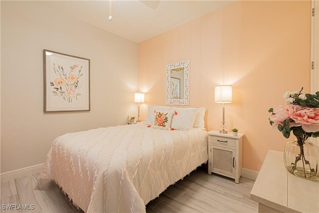 bedroom with light hardwood / wood-style floors