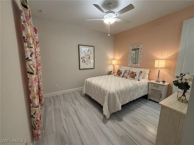 bedroom featuring ceiling fan and light hardwood / wood-style floors