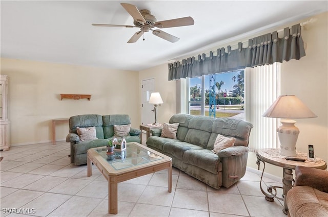 living room with light tile patterned floors and ceiling fan